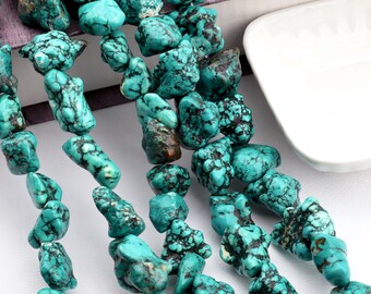 May include: Close-up of turquoise gemstone beads. The beads are a vibrant turquoise color with dark matrix patterns. The beads are irregular in shape and size, suggesting a natural, handcrafted appearance. The beads are strung together, ready for jewelry making.