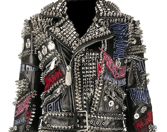 May include: Black leather jacket with silver studs and patches. The jacket has a zipper closure, a belt, and long sleeves.