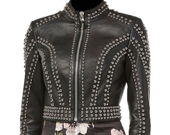 May include: A black leather jacket with silver studs. The jacket has a zipper closure and a stand-up collar.