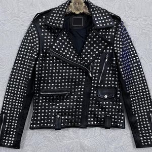 May include: Black leather jacket with silver stud embellishments. The jacket has a notched collar, multiple zipped pockets, and a front zip. The sleeves have zips at the cuffs. A fashionable and edgy outerwear item.