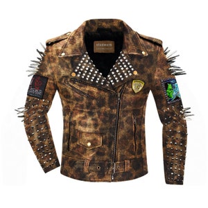 May include: Brown leather jacket with a distressed finish, featuring silver studs, spikes, and patches. The jacket has a zipper closure, a small pocket, and a belt. The brand name "studwork" is visible on the collar.