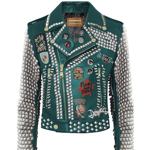 May include: A teal leather jacket adorned with silver metal studs and patches. The sleeves are covered in silver studs. The jacket features a zip closure and various decorative pins. Text on the jacket reads "Punks Not Dead" and "Cannibal Corpse".
