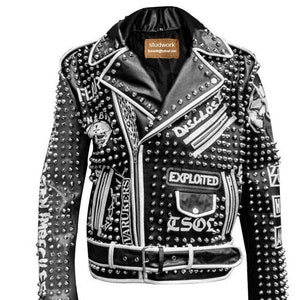 May include: Black leather jacket with silver studs and white patches. The patches have text including "Fear", "Disclose", "The Exploited", "Varukers", and "TSOL".