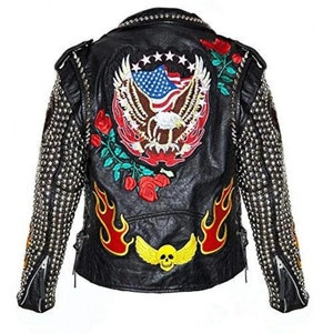 May include: Black leather jacket with silver studs on the sleeves and collar. The back features an embroidered American flag, eagle, and roses. Red flames and a yellow skull with wings are also embroidered on the jacket.