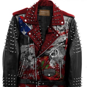 May include: A black and red leather jacket with silver studs. The jacket features a graphic print on the front and back, including a peace sign, skulls, and the word "Distillery". The jacket has a black belt with silver buckles.