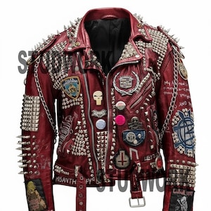 May include: A burgundy leather jacket heavily embellished with silver studs, spikes, and patches. The jacket features a zipper closure, a belt, and various decorative pins and chains. Text includes "MISANTHROPY" and "LEYT".