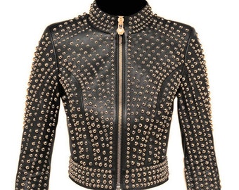 May include: A black leather jacket with gold-toned studs. The jacket has a zipper closure and long sleeves.