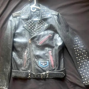 Dynamic Black Cowhide Leather Biker Jacket Punk Rock Style with Silver Studs & Red-Toned Zippered Pockets