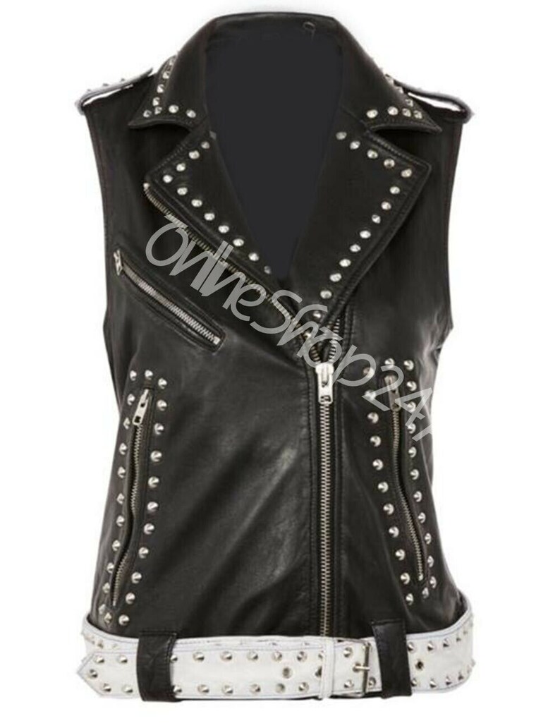 May include: Black leather vest with a white belt and silver studs. The vest has a zipper closure and two pockets.