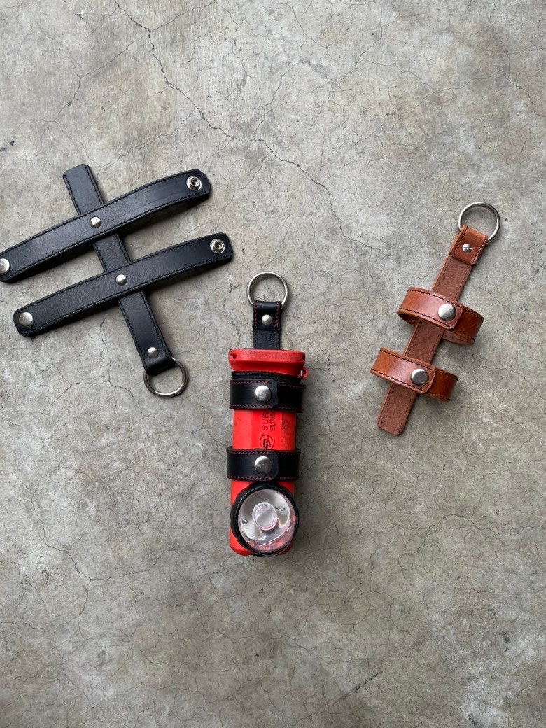 Firefighter inverted flashlight holder
