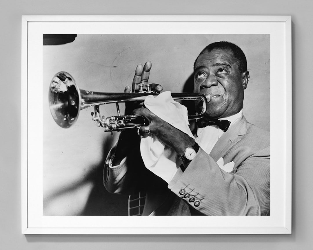 Louis Armstrong intensely playing trumpet, classic black & white