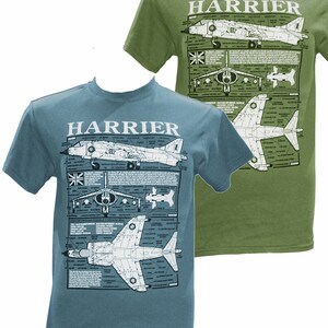 May include: Two t-shirts with a graphic print of a Harrier jet. The t-shirts are in different colors, one is green and the other is blue.