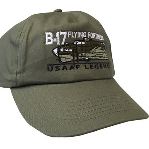 May include: A green baseball cap with an embroidered image of a B-17 Flying Fortress airplane and the text "B-17 FLYING FORTRESS USAAF LEGEND".