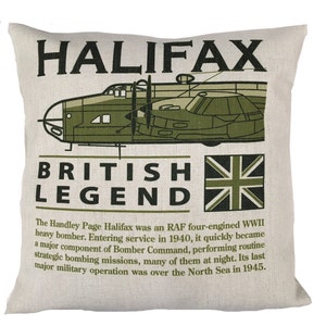 May include: A beige cushion with a green illustration of a Handley Page Halifax bomber plane. The text "HALIFAX" is printed in large green letters above the plane. Below the plane, the text "BRITISH LEGEND" is printed in black letters. The Union Jack flag is printed to the right of the text. The text below the flag reads: "The Handley Page Halifax was an RAF four-engined WWII heavy bomber. Entering service in 1940, it quickly became a major component of Bomber Command, performing routine strategic bombing missions, many of them at night. Its last major military operation was over the North Sea in 1945."