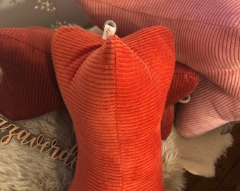 Reading bones made of cuddly soft corduroy in candy colors