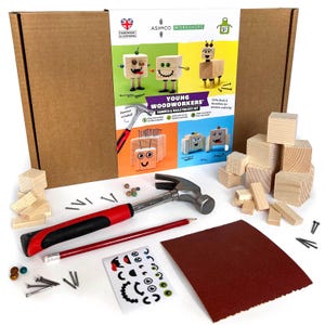May include: A wooden toy making kit for young woodworkers. The kit includes a hammer, nails, sandpaper, wooden blocks, and stickers. The box has a picture of three wooden robots with different expressions.