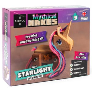 May include: A wooden unicorn craft kit called "Mythical Makes: Build Starlight the Unicorn!"  The kit includes all the pieces needed to build a unicorn, along with yarn for the mane and tail. The box is pink and purple with a picture of the finished unicorn.