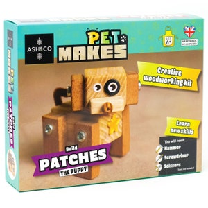 May include: A wooden toy dog kit called "Patches the Puppy" from Pet Makes. The kit is a creative woodworking project for ages 6 and up. The box features a photo of the finished wooden dog, along with instructions on how to build it. The kit includes all the necessary materials, including wood, screws, and sandpaper. Tools are not included.