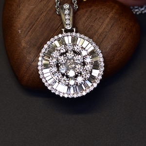 14 karat white gold natural diamond baguette and round disc pendant