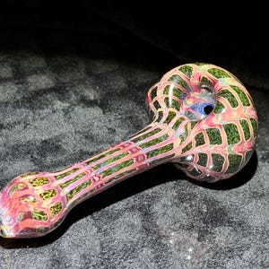 Old school style wrap and rake pocket pipe in reds and greens with hints of fume