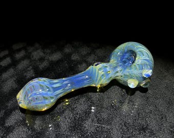 Thick glass pocket pipe in metallic blues with ghostly purple wrap and rake exterior