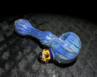 Large and thick color changing glass hand pipe with fume and frit, clear line work, and large implosion marble in metallic blues