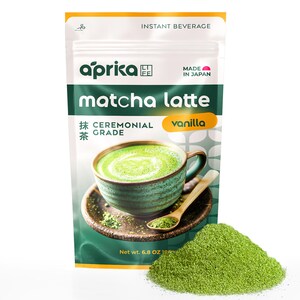 May include: A green pouch with a white label that reads "aprika matcha latte vanilla ceremonial grade" and a picture of a green matcha latte. The pouch is labeled "Instant Beverage" and "Made in Japan".