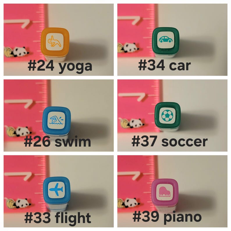May include: A set of ten colorful rubber stamps with different icons and numbers. The icons include a yoga pose, a car, a swimmer, a soccer ball, an airplane, and a piano. The numbers range from 24 to 39.