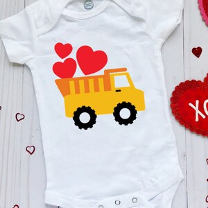 White Baby Bodysuit With A Dump Truck Full Of Valentine's Hearts  Valentines Baby Bodysuit