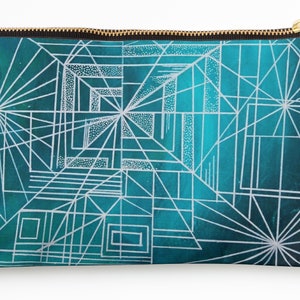 May include: A teal blue zippered pouch with a white geometric pattern. The pattern is made up of lines and squares.