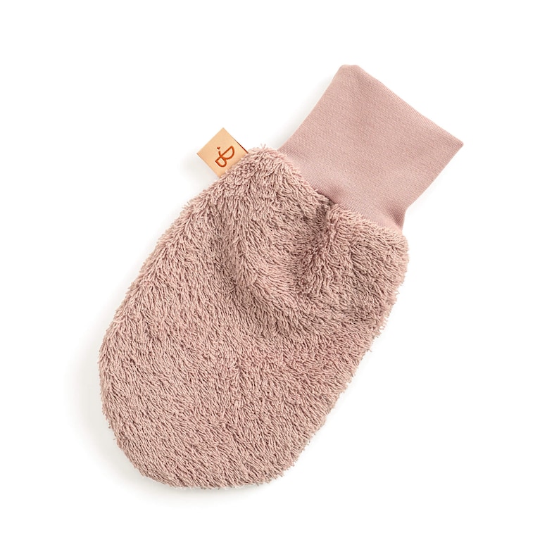 May include: A soft, pink, terrycloth washcloth with a pink cotton cuff. The washcloth is designed for gentle cleansing and is perfect for babies and sensitive skin.