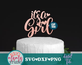 May include: A pink glitter cake topper with the text "it's a girl" and a heart. The topper is on a white cake. The text "cut file" is in a circle below the topper. The text "SVG mama STUDIO SVG♥DXF♥PNG digital file" is below the cake.