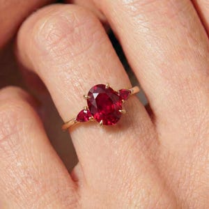 Rose Gold Oval Ruby Ring with Pear Side Stones | Three Stone Engagement Ring | Deep Red Gemstone Anniversary Gift for Her
