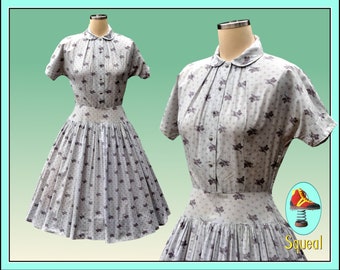 Vestido vintage de los años 50 con cintura caída y estampado de hojas