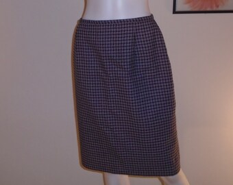 May include: A black and gray checkered skirt with a straight silhouette.