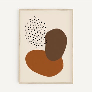 Puede incluir: Impresi&oacute;n de arte abstracto con formas marrones y naranjas sobre un fondo crema. La impresi&oacute;n presenta un patr&oacute;n de lunares negros y blancos.
