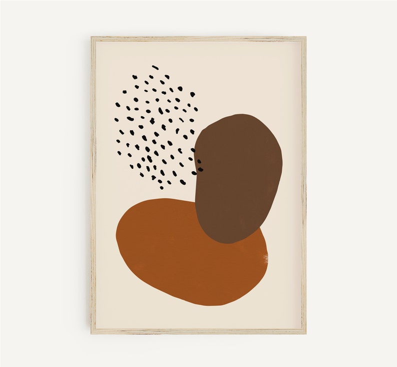 Puede incluir: Impresi&oacute;n de arte abstracto con formas marrones y naranjas sobre un fondo crema. La impresi&oacute;n presenta un patr&oacute;n de lunares negros y blancos.