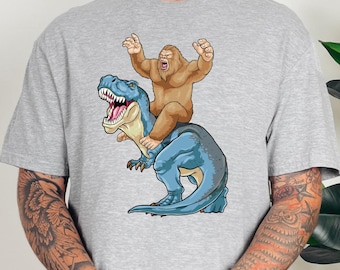 Supernatural Cryptid Shirt Bigfoot Riding Dinosaur T-Shirt Sasquatch Gifts for Monster Hunter