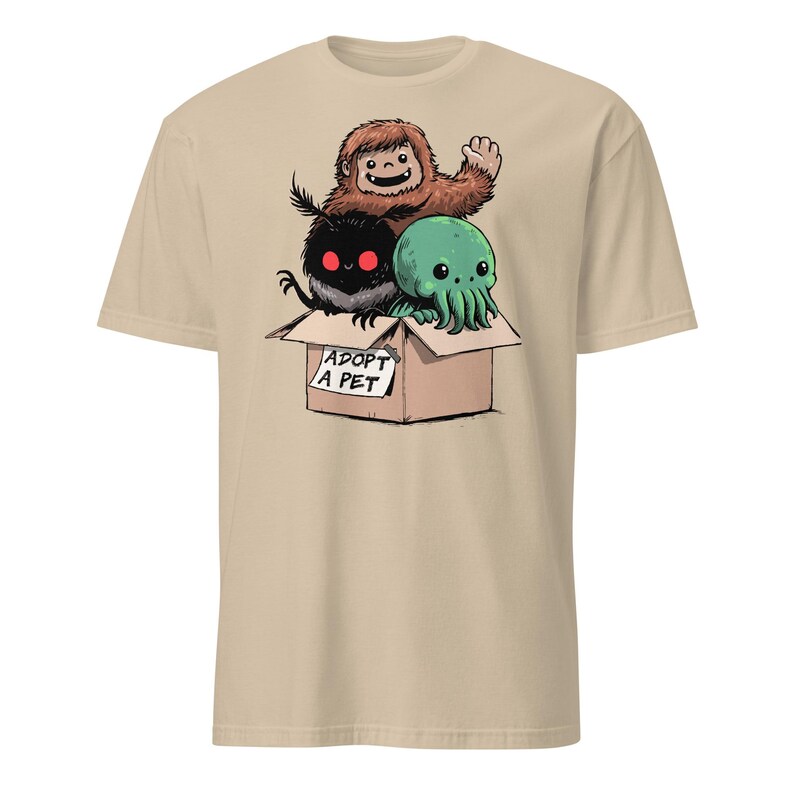 Adopt a Cryptid Shirt Funny Bigfoot Gifts for Monster Hunter Weird Stuff Folk Horror Shirt Sand
