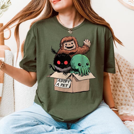 Adopt a Cryptid Shirt Funny Bigfoot Gifts for Monster Hunter Weird Stuff Folk Horror Shirt