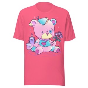 May include: Pink and blue patched teddy bear holding a bouquet of pink roses. The bear is sitting on a purple pentagram with two purple and white candles.