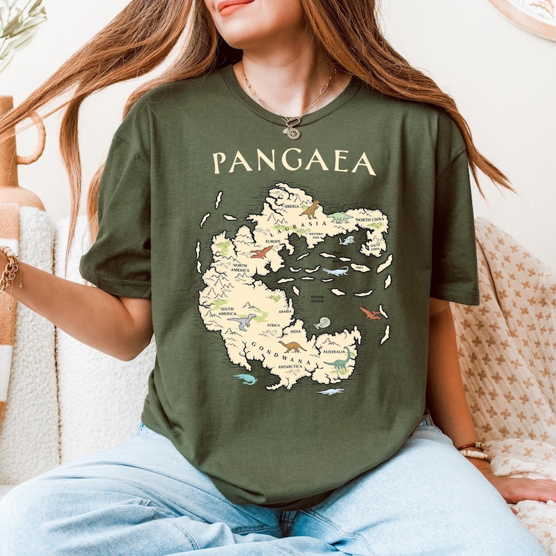 Educational science T-shirt with a vintage "Pangaea" map graphic featuring labeled supercontinent regions and small colorful dinosaurs, ideal for geology fans, paleontology students, or as a unique academic gift.