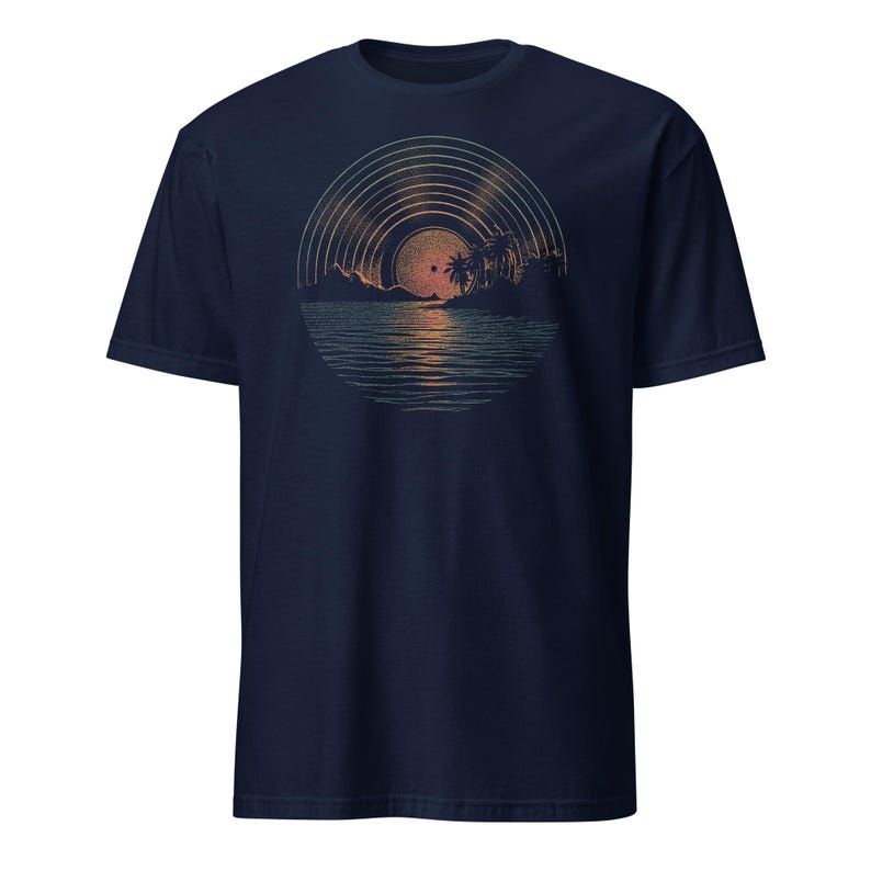 Man wearing a black t-shirt featuring a retro sunset illustration shaped like a vinyl record, showing palm trees, a glowing sun, and reflective ocean waves in warm orange and green tones.