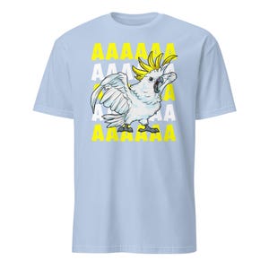 Vibrant red T-shirt featuring a cartoon sulfur-crested cockatoo screaming with its wings spread against a background of repeating "AAAAAA" text, ideal for bird owners, parrot lovers, and fans of chaotic, loud-humor graphic apparel.