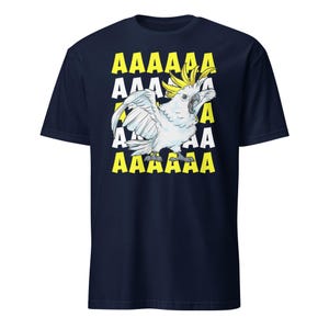 Vibrant red T-shirt featuring a cartoon sulfur-crested cockatoo screaming with its wings spread against a background of repeating "AAAAAA" text, ideal for bird owners, parrot lovers, and fans of chaotic, loud-humor graphic apparel.