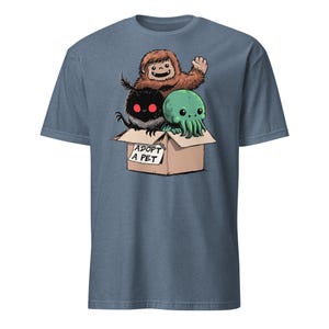 Adopt a Cryptid Shirt Funny Bigfoot Gifts for Monster Hunter Weird Stuff Folk Horror Shirt Heather Indigo