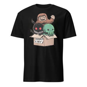 Adopt a Cryptid Shirt Funny Bigfoot Gifts for Monster Hunter Weird Stuff Folk Horror Shirt Black