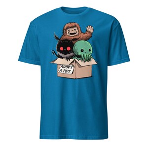 Adopt a Cryptid Shirt Funny Bigfoot Gifts for Monster Hunter Weird Stuff Folk Horror Shirt Sapphire