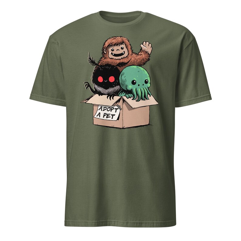 Adopt a Cryptid Shirt Funny Bigfoot Gifts for Monster Hunter Weird Stuff Folk Horror Shirt Military Green