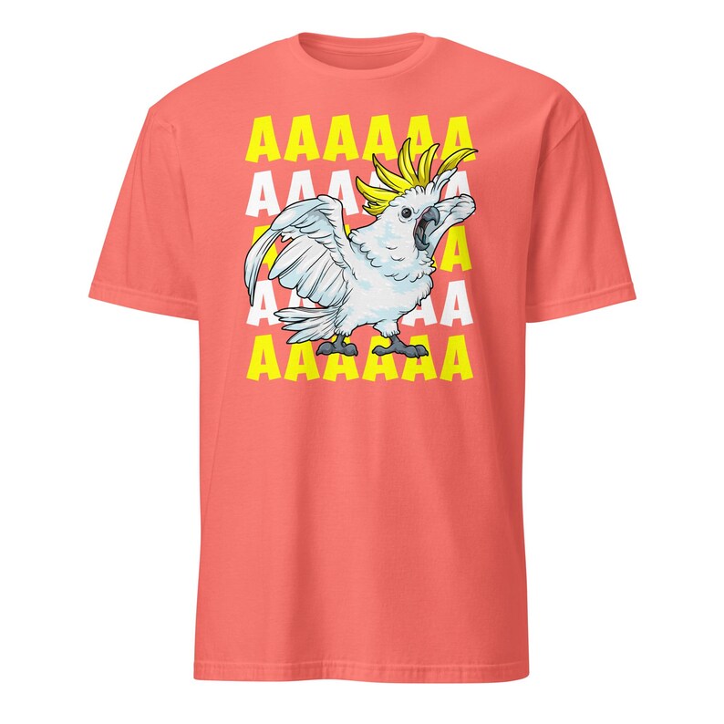 Vibrant red T-shirt featuring a cartoon sulfur-crested cockatoo screaming with its wings spread against a background of repeating "AAAAAA" text, ideal for bird owners, parrot lovers, and fans of chaotic, loud-humor graphic apparel.